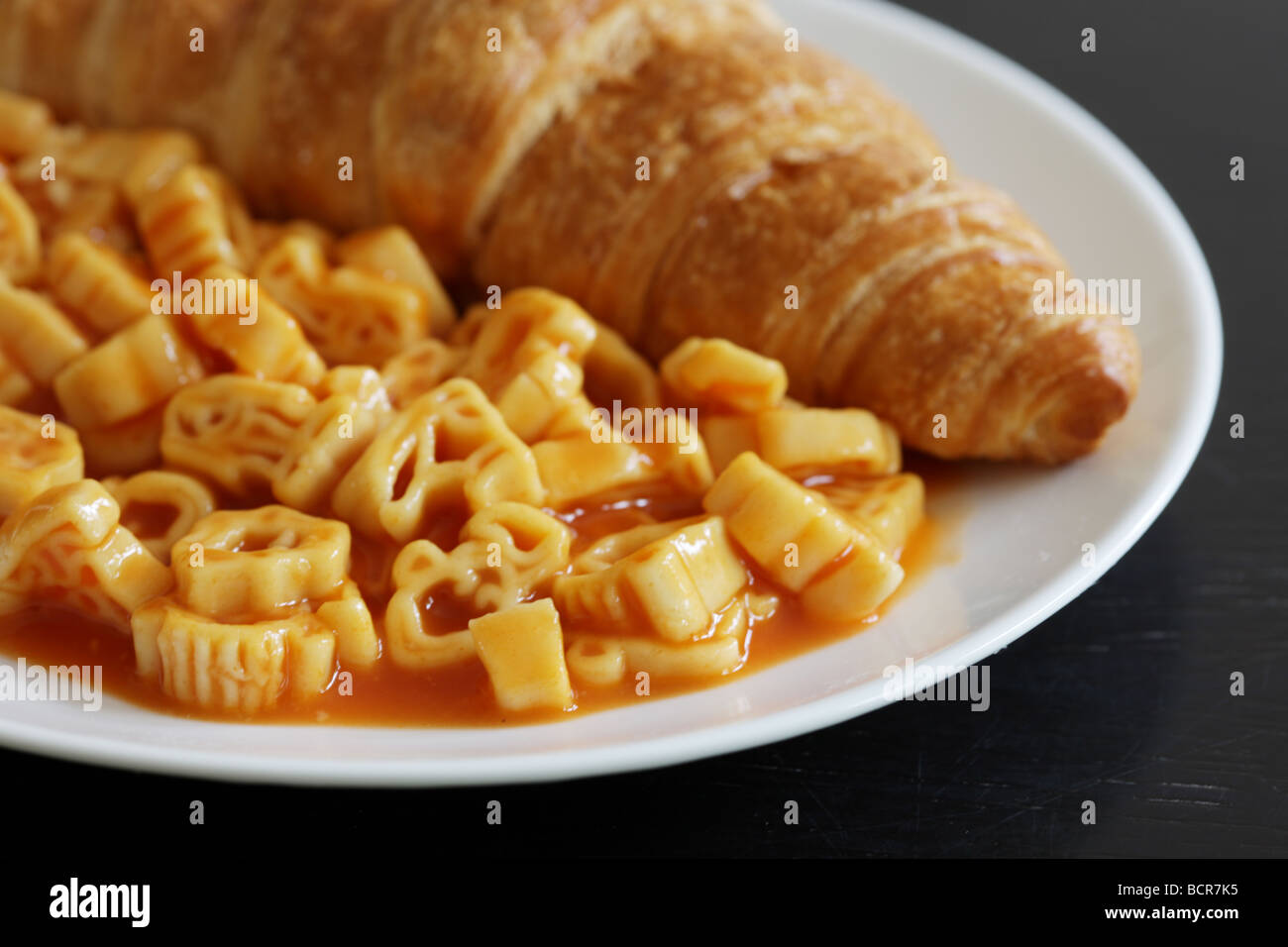 Freshly Baked Golden Croissant With Pasta Shapes In Tomato Sauce Meal
