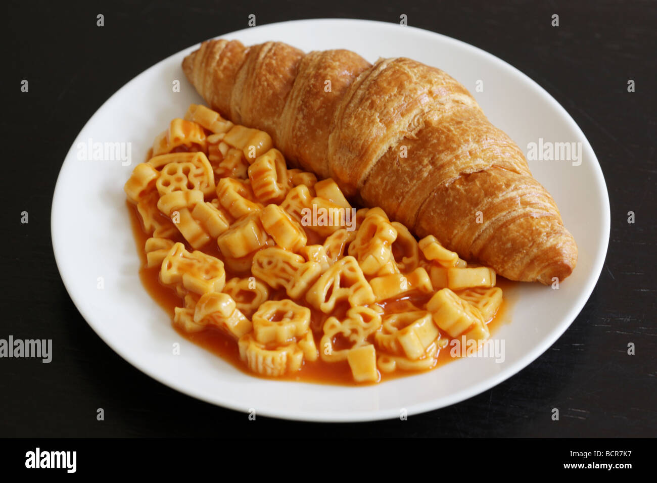 Freshly Baked Golden Croissant With Pasta Shapes In Tomato Sauce Meal With No People Stock Photo