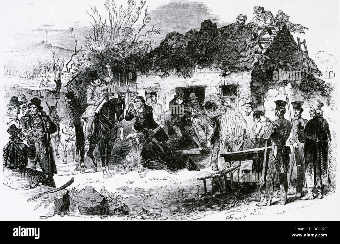 IRISH EVICTIONS  - A landowner evicts poor farm tenants and demolishes their house in the 1840s Stock Photo