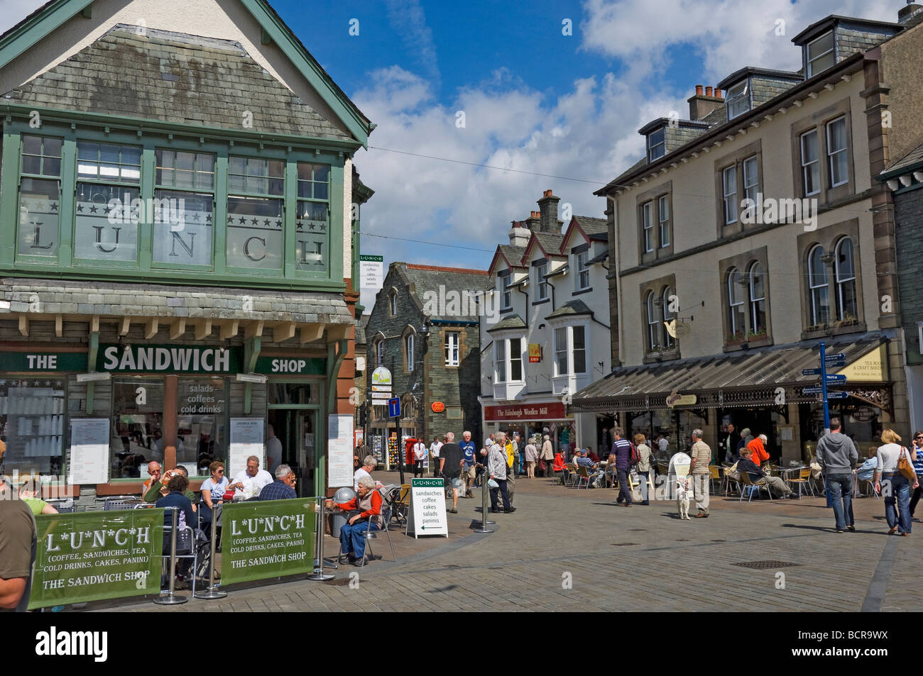 People tourists visitors in Market place in summer Keswick Cumbria England UK United Kingdom GB Great Britain Stock Photo