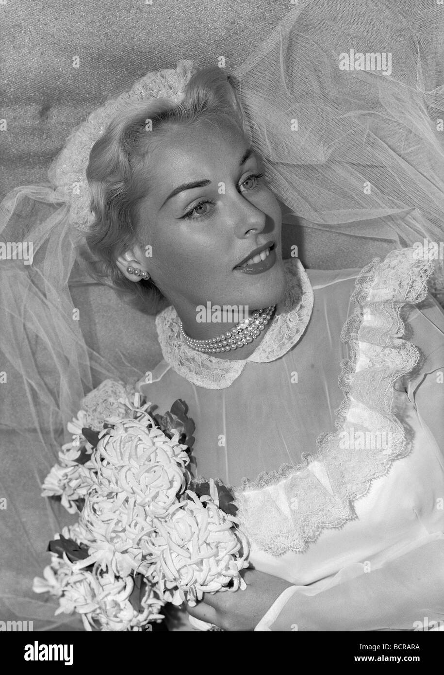 Studio portrait of bride smiling Stock Photo - Alamy
