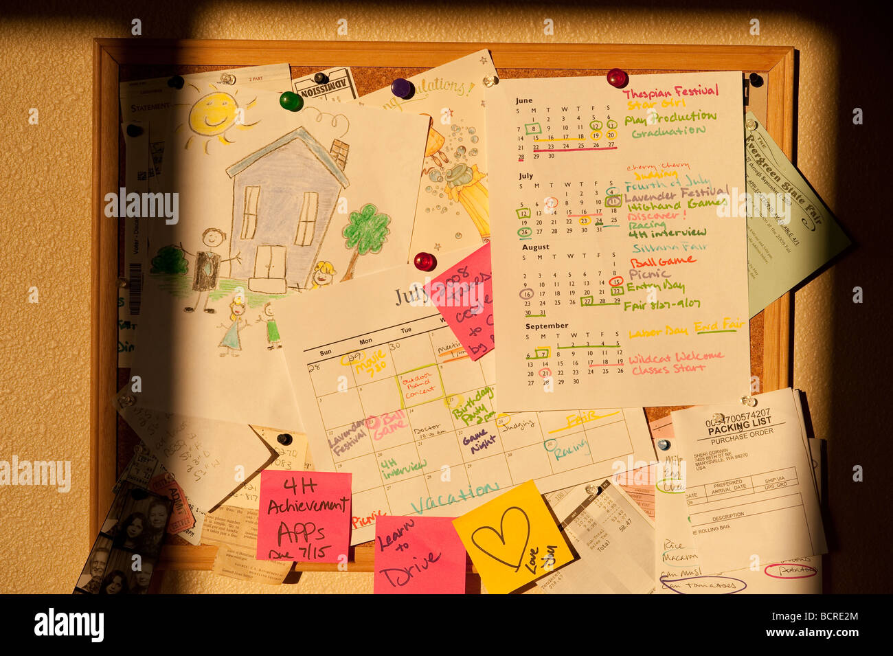 Home bulletin board with notes schedules reminders and important dates to remember Stock Photo