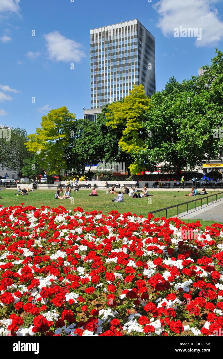 The Marble Arch traffic junction and roundabout with summer flower beds ...