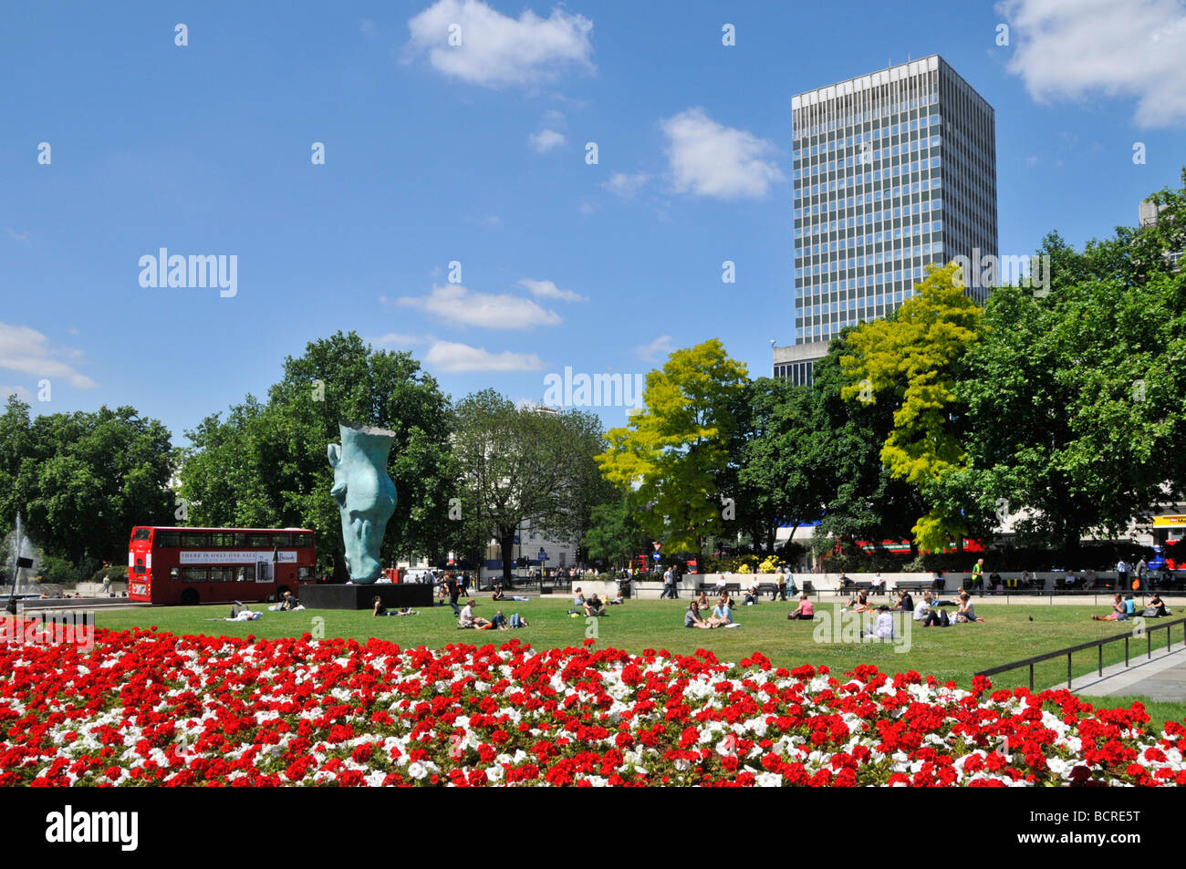 The Marble Arch traffic junction and roundabout with summer flower beds ...