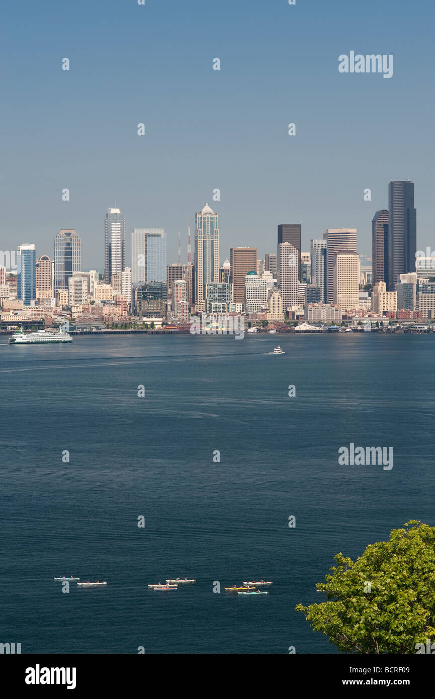 Retro image of Seattle skyline from West Seattle with boats in Elliott Bay on a bright sunny day Washington State USA Stock Photo