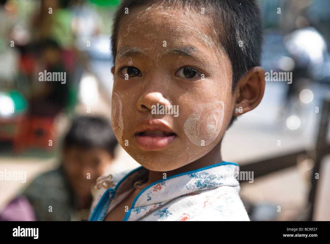 Girl wearing traditional Thanaka make up, Yangon, Burma/Myanmar, Asia ...
