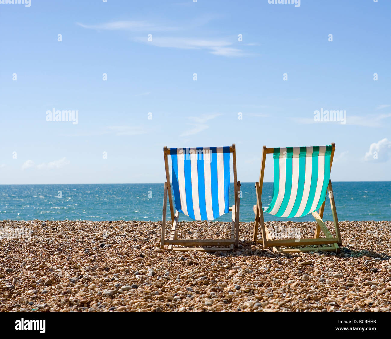 Deck chairs on Brighton beach Stock Photo