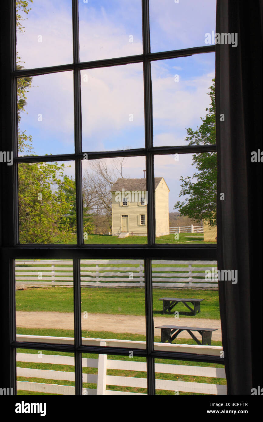 View of Water house through window of Meeting House at Shaker Village of Pleasant Hill Harrodsburg Kentucky Stock Photo
