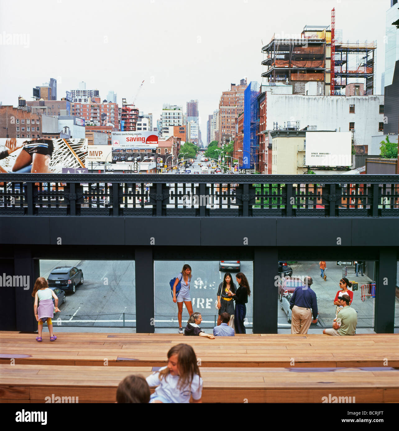 The new High Line Park wooden seating architecture with people family viewing windows over city and streets of New York City NYC USA US  KATHY DEWITT Stock Photo