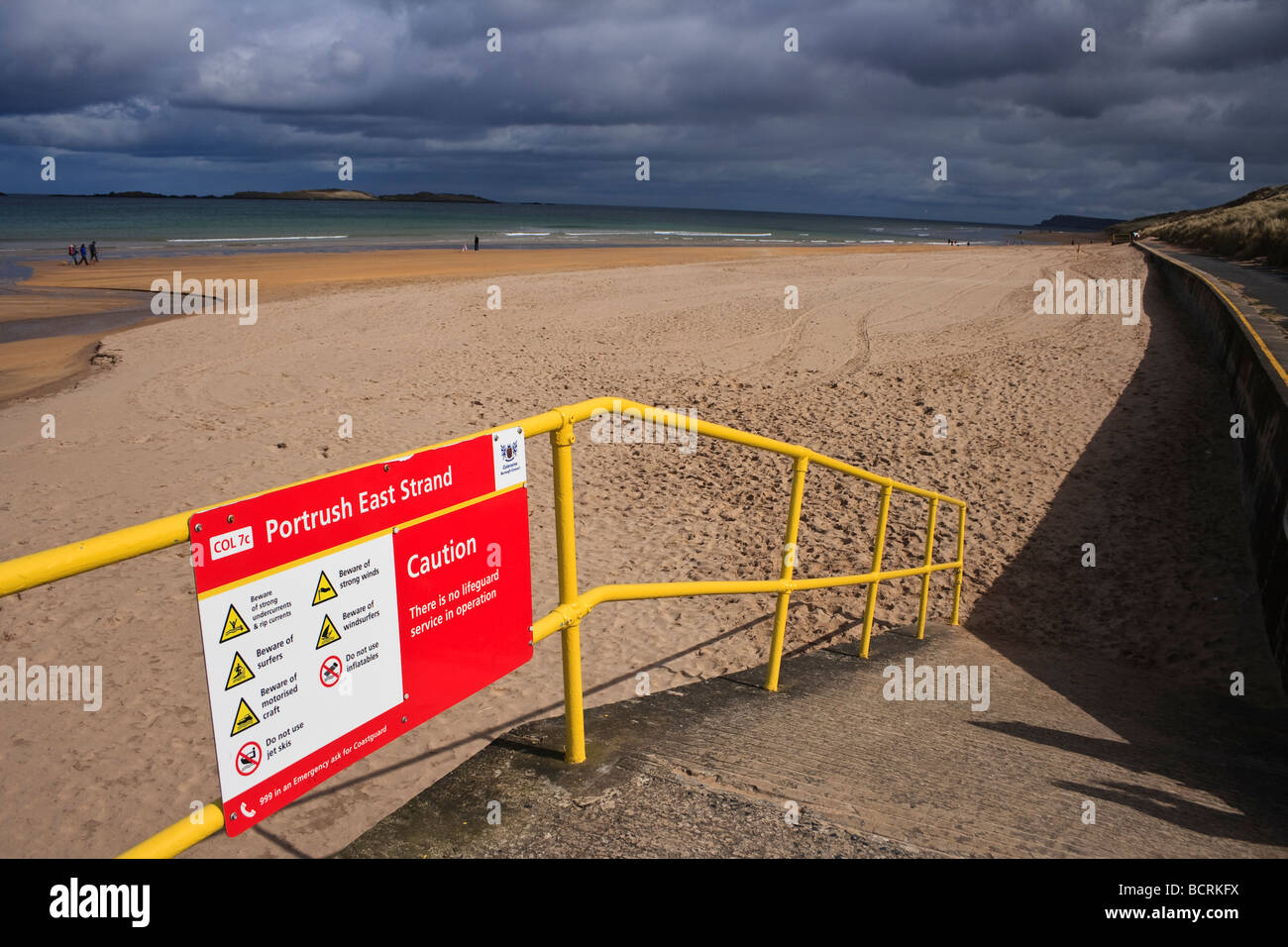 Looking east long Portrush East Strand on a clooudy day Stock Photo