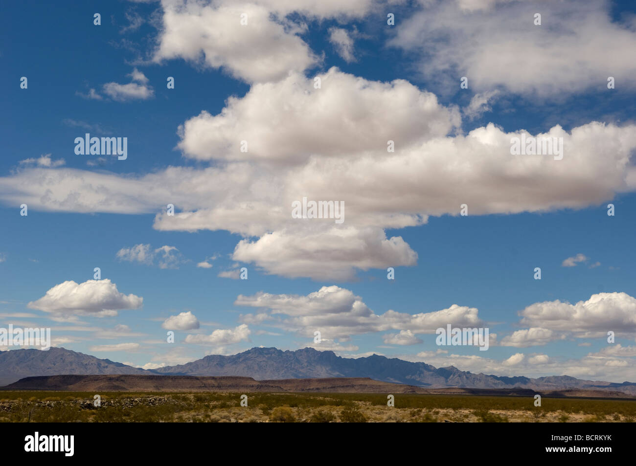 Clouds over desert Stock Photo - Alamy