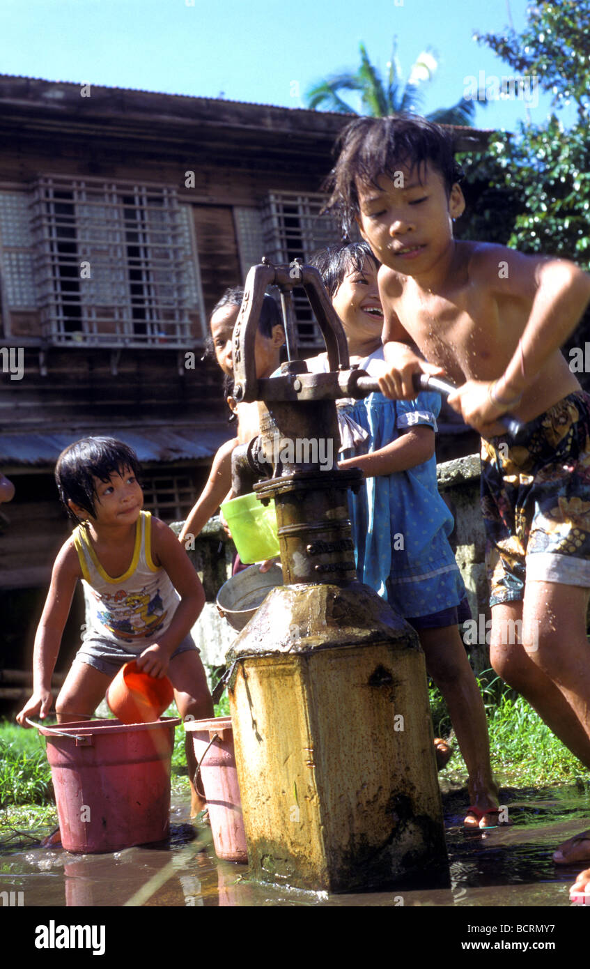 children with water pump bohol philippines Stock Photo Alamy