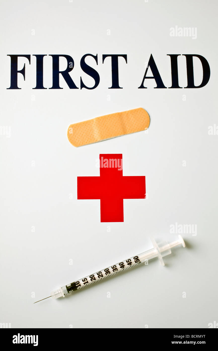 First aid bandaid and syringe Stock Photo