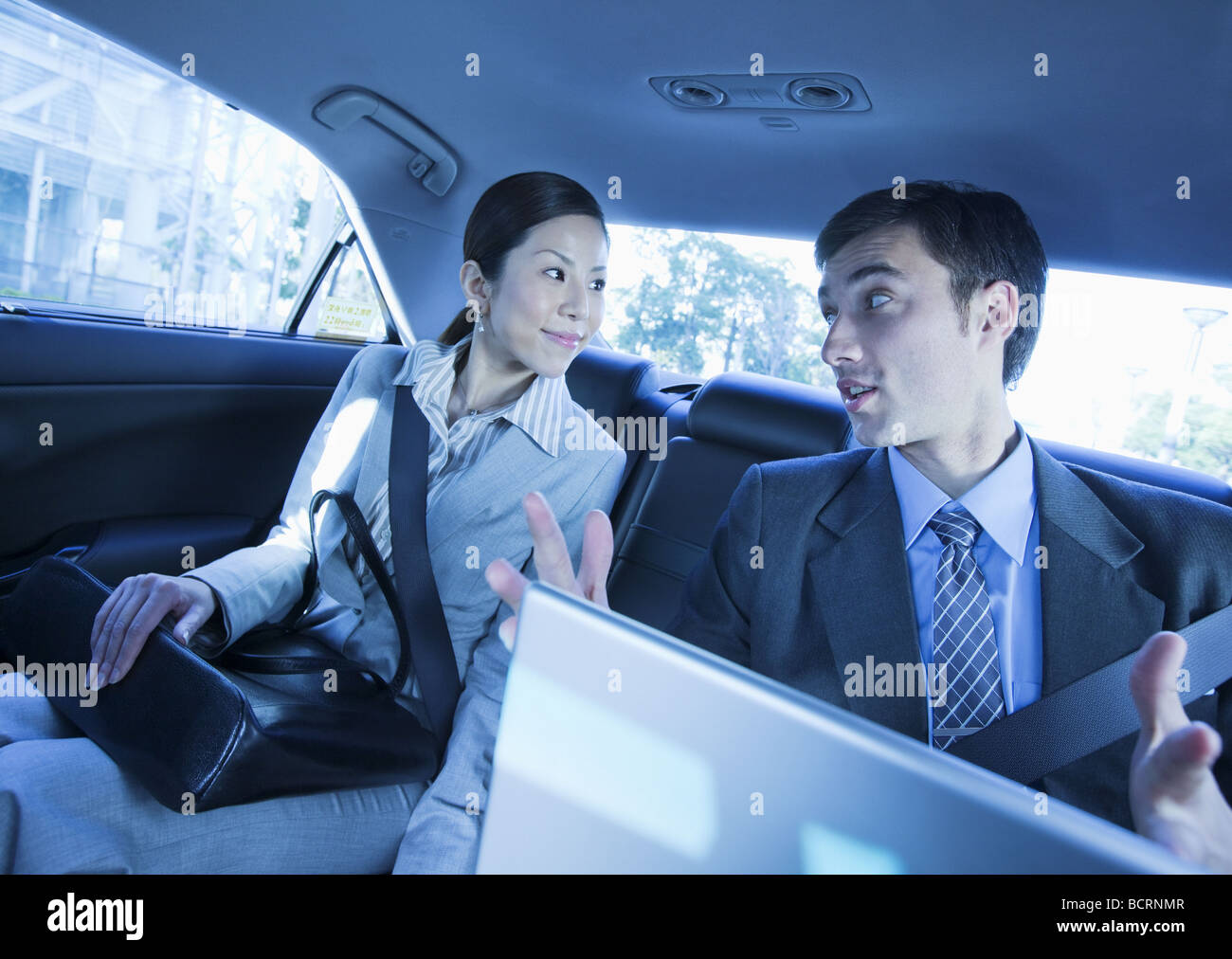 Businessman and businesswoman having meeting Stock Photo - Alamy
