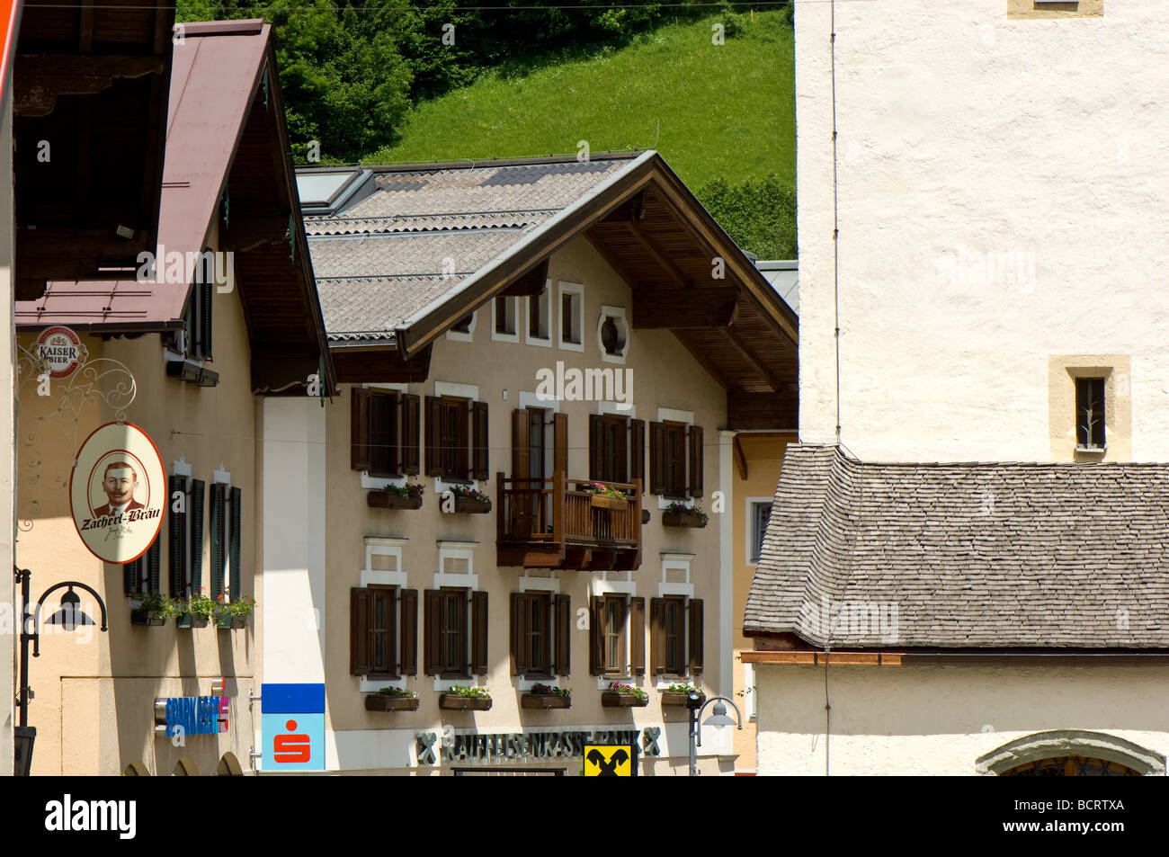 Traditional Austrian buildings, mainly wooden construction, louvered windows and window boxes. Stock Photo