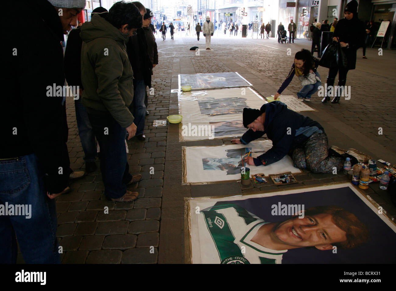 Artist working in the city centre, Manchester UK Stock Photo Alamy