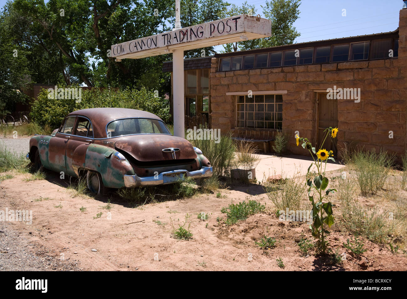 Old abandoned car in front of a closed restaurant near Mexican Water, Utah Stock Photo