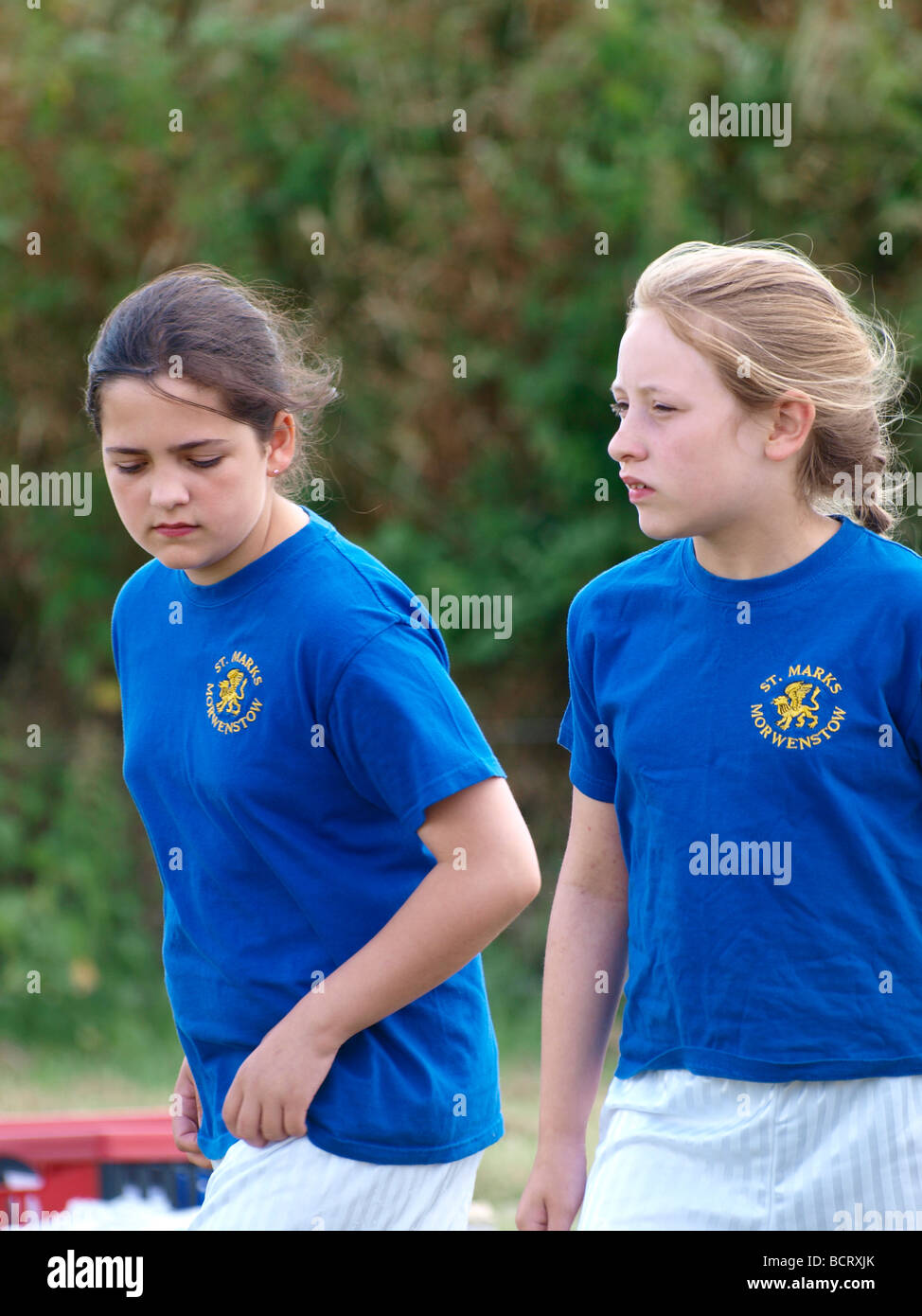Two young girls preparing to start a running race Stock Photo
