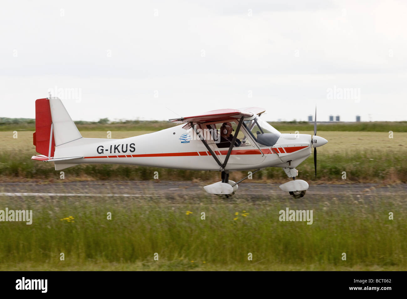 Ikarus C42 FB UK G-IKUS commencing take-off runat Wickenby Airfield Stock Photo