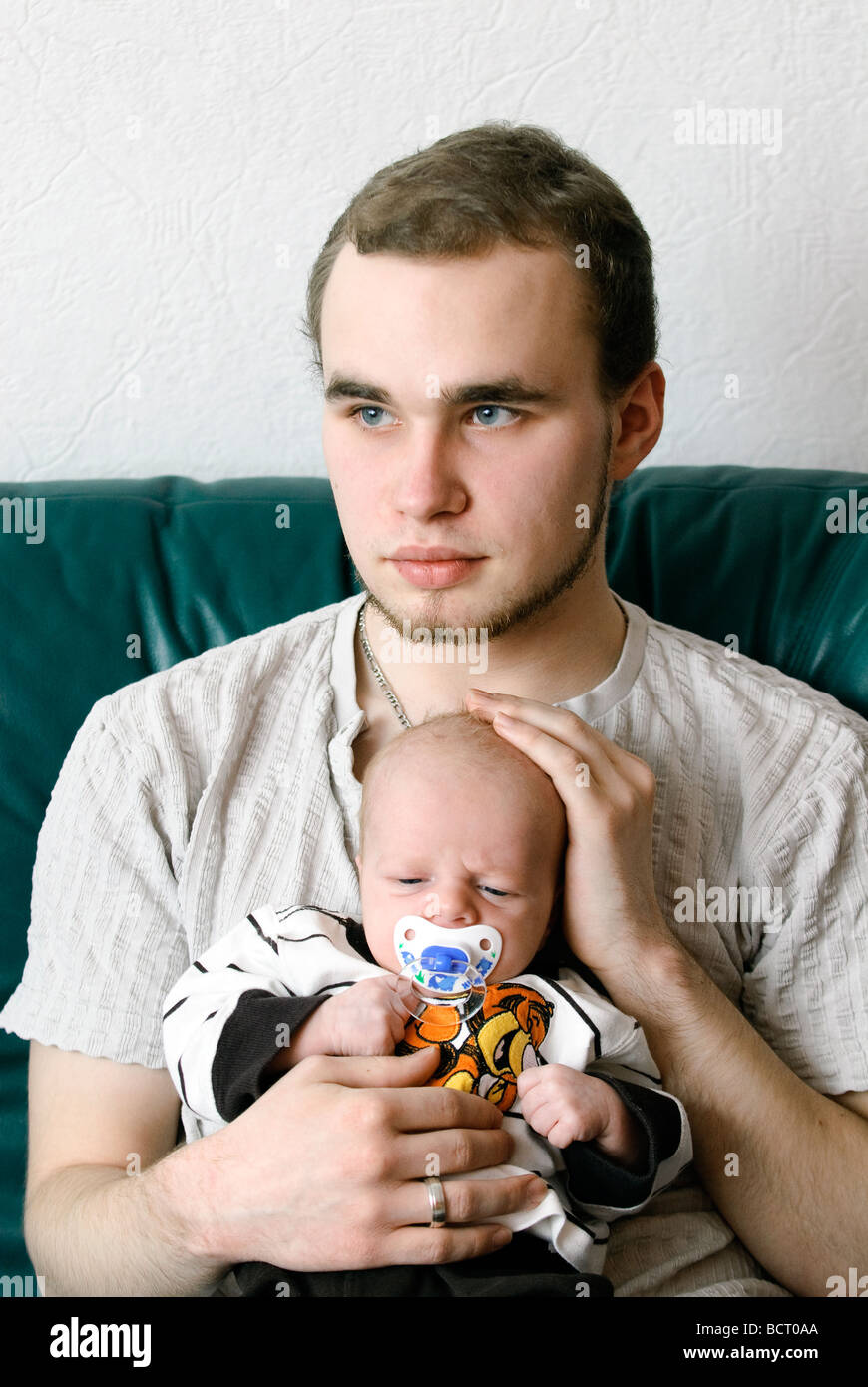 Teenage father holding baby hires stock photography and images Alamy