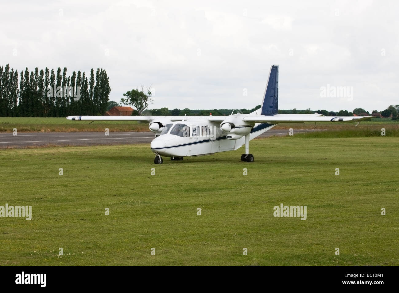 Britten-Norman BN2A Islander G-AWNT taxiing in after landing at Wickenby Airfield Stock Photo