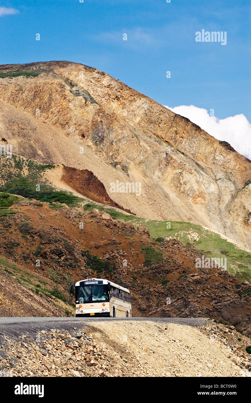 Park tour bus on the narrow winding road through Denali National Park, Alaska, USA Stock Photo