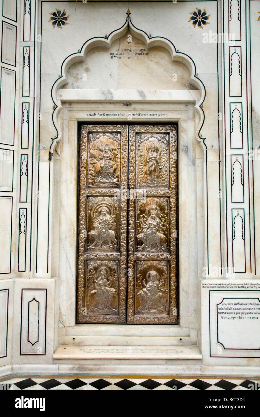 Ornately decorated silver metal carved doors at the Sri Durgiana Hindu Temple, Amritsar. India. Stock Photo
