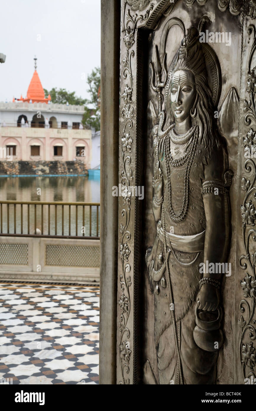 Ornately decorated silver metal carved doors at the Sri Durgiana Hindu Temple, Amritsar. India. Stock Photo