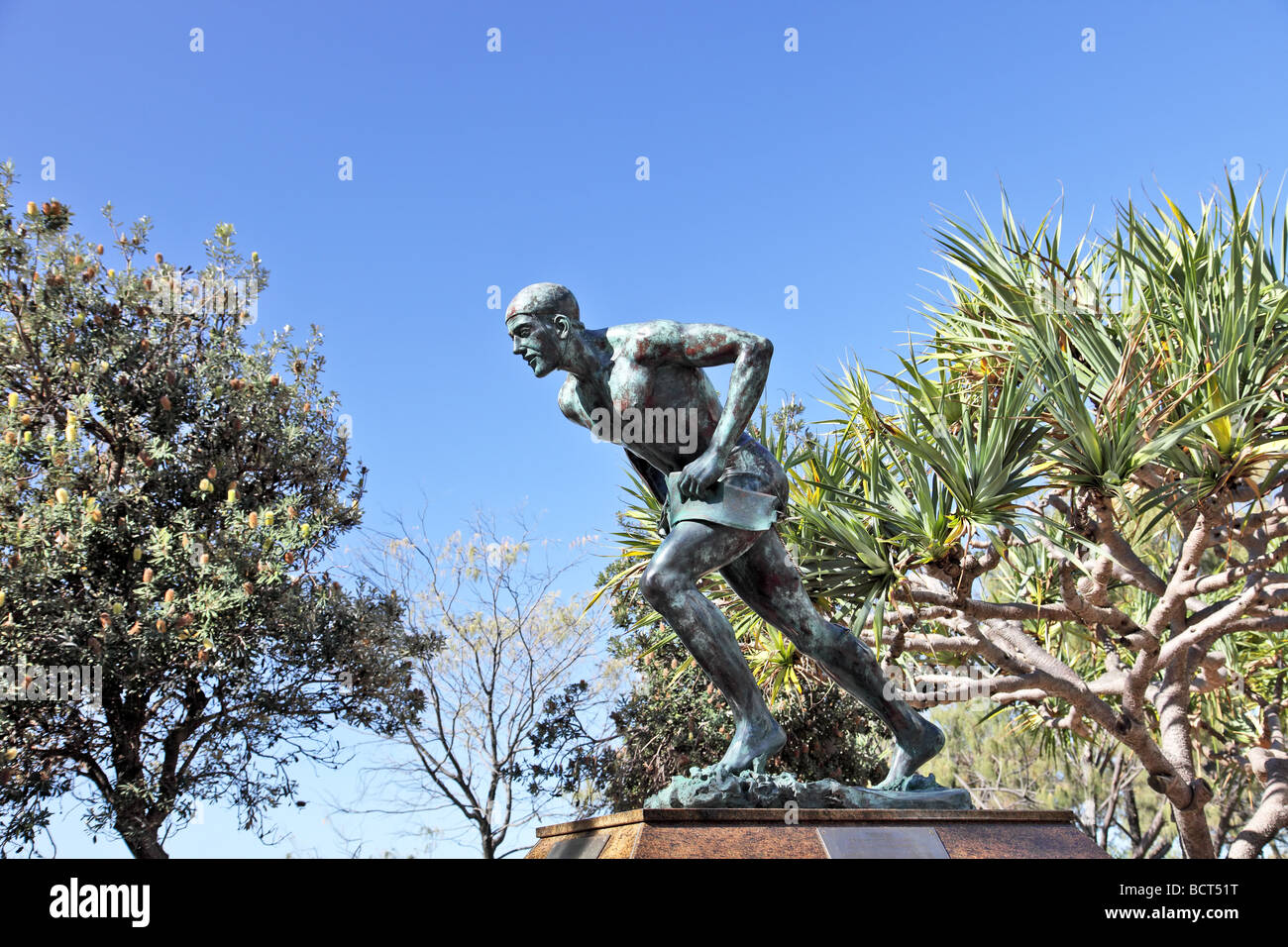 Bronze statue of an Australain lifesaver near a beach with belt and rope Stock Photo