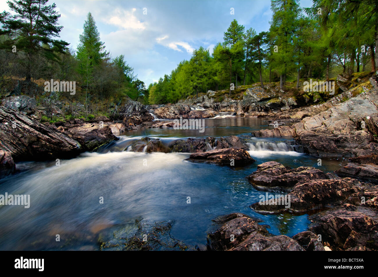The beautiful Achness Falls at low spate taken at Glen Cassley, Sutherland in Scotland on a bright spring evening Stock Photo