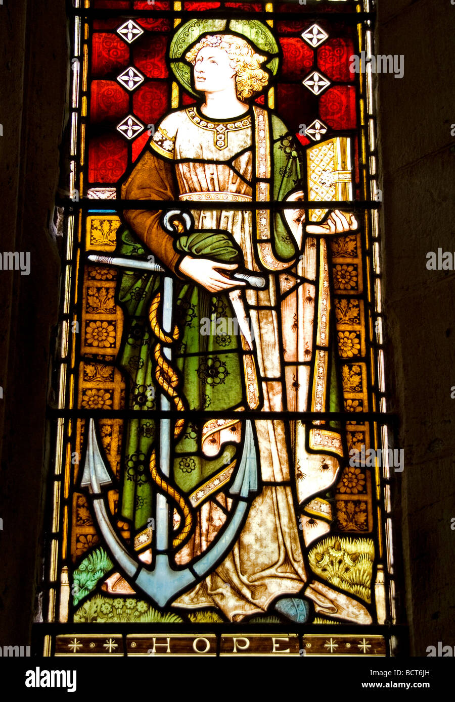 Hope one of three mythical sisters depicted in the stained Glass at Eaton Bishop church Herefordshire Stock Photo