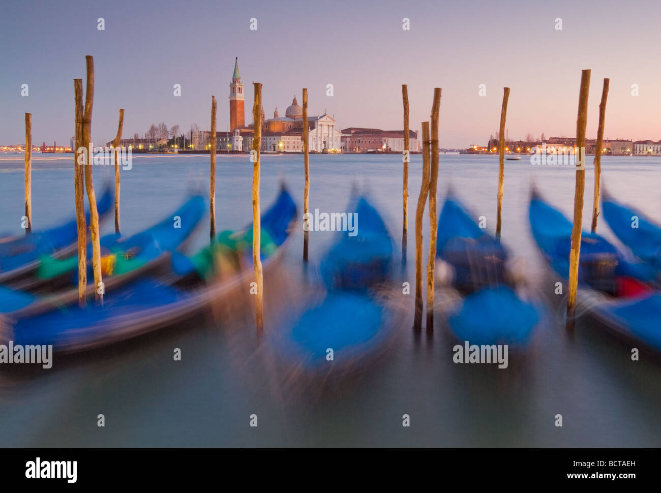 Venice Gondolas moored at night in the Bacino di san Marco, St Mark's Basin, waterfront, Venice, Italy, EU, Europe Stock Photo