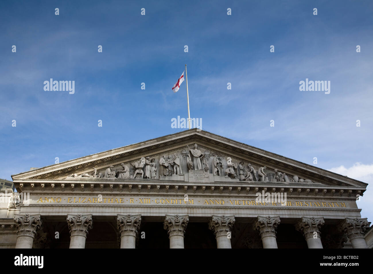 The upper front facade of the Royal Exchange in the City of London, England. Stock Photo