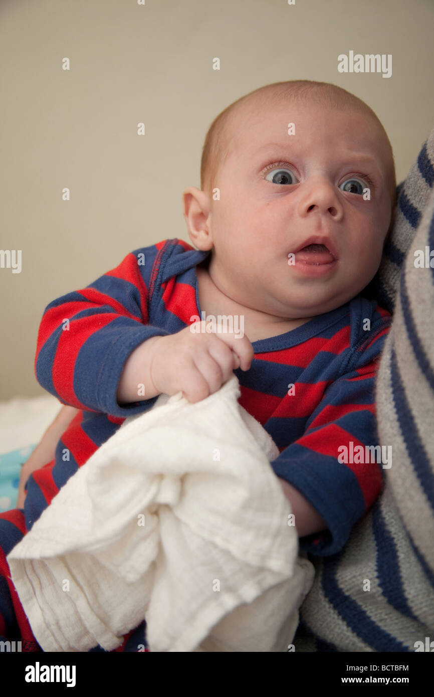 Two month old baby boy in his mothers arms Stock Photo Alamy