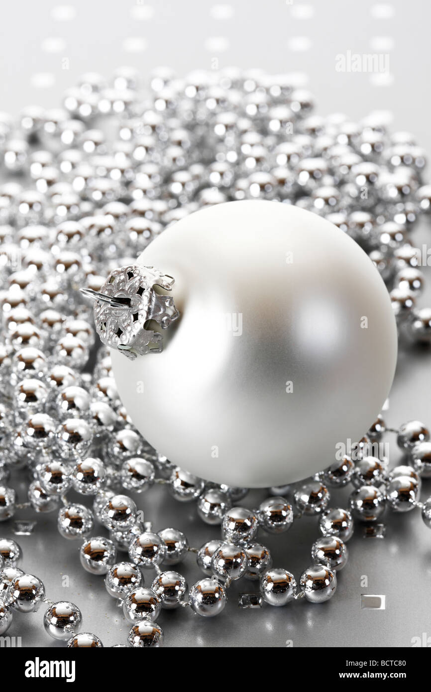Silver bead chain with Christmas ball Stock Photo