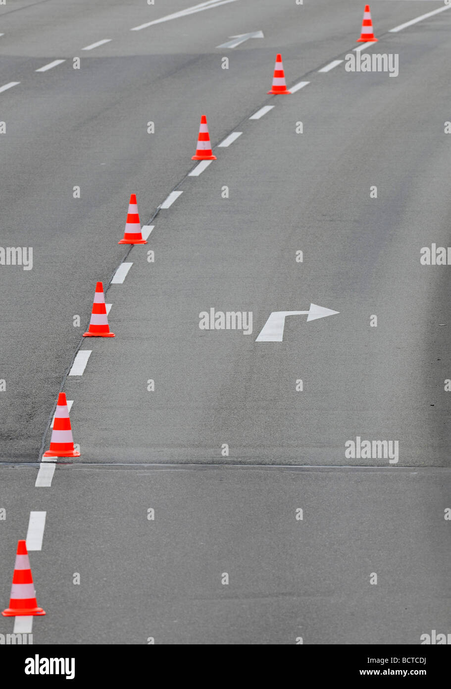 Traffic cones dividing a road lane Stock Photo