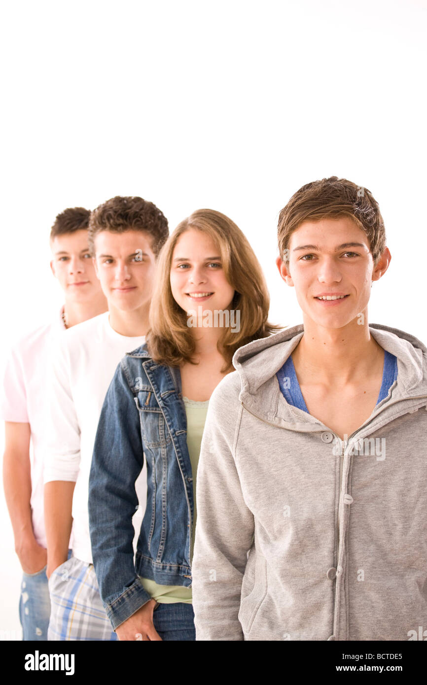 Portrait of a group, three boys and a girl Stock Photo - Alamy