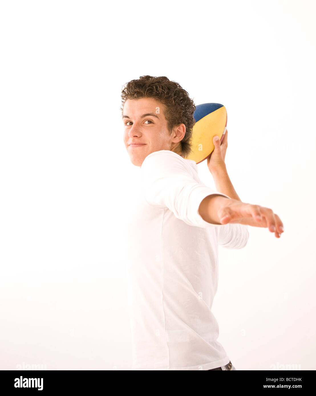 Boy throwing a football Stock Photo Alamy