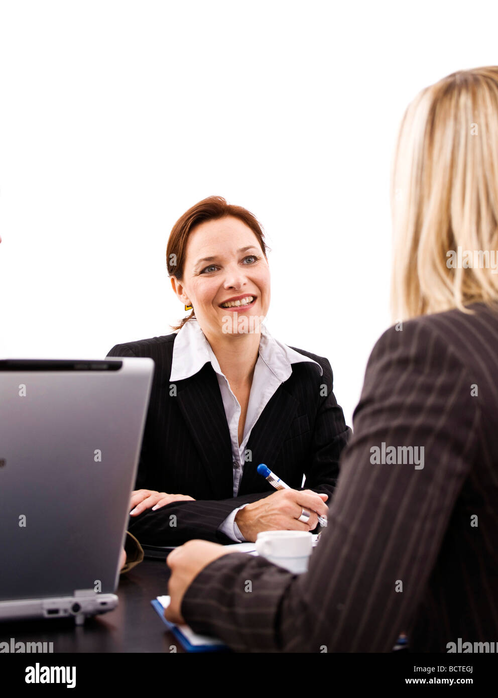 Two business women at a meeting Stock Photo - Alamy