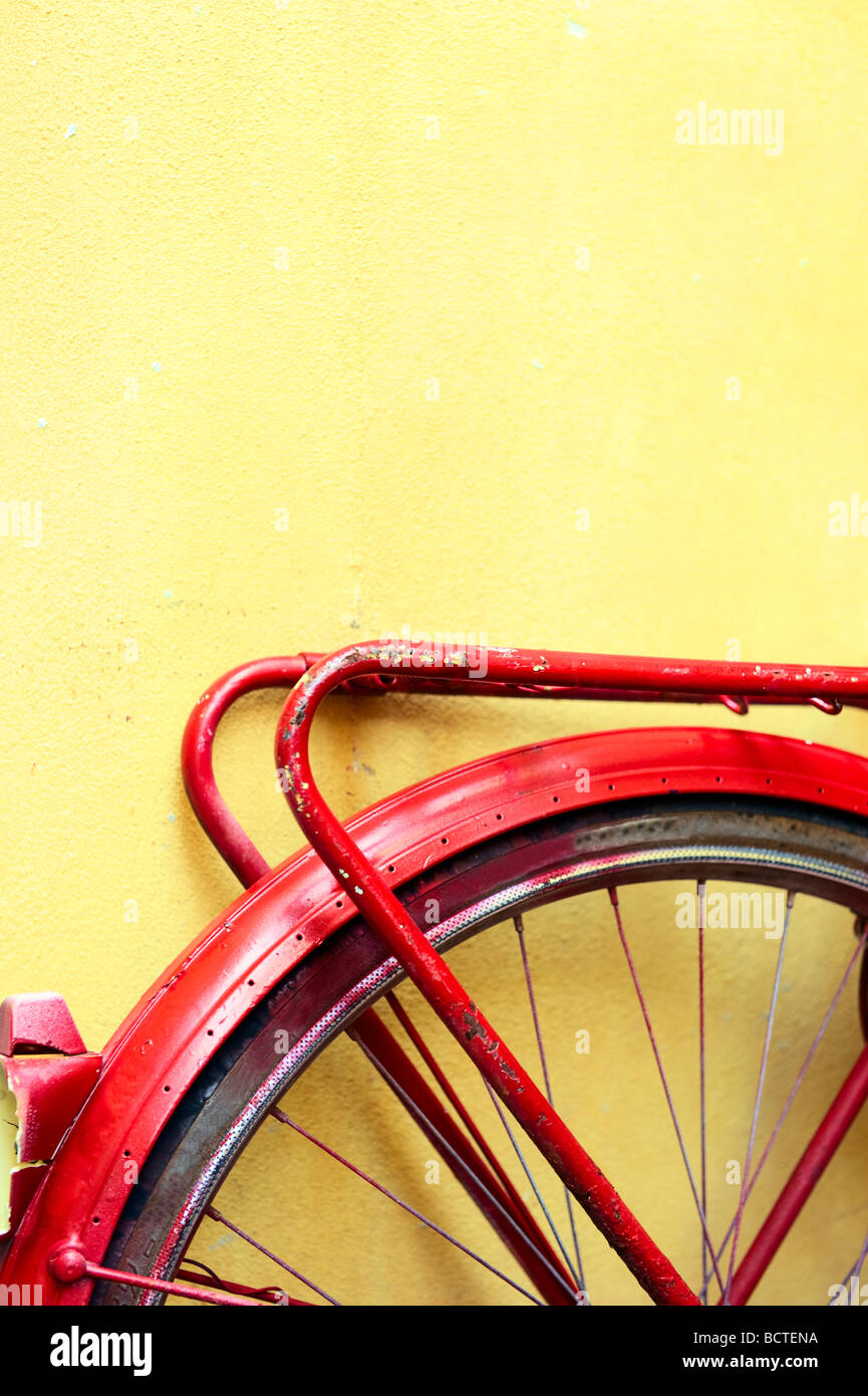 Rear wheel of an old bicycle painted red Stock Photo