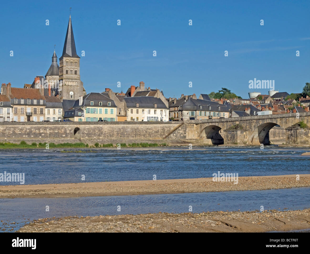 river Loire at bank with sand in the background town La Charite sur Loire at the bridge Stock Photo