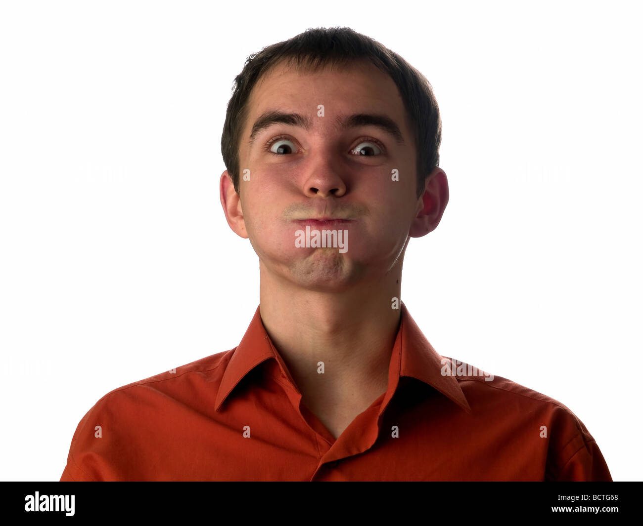Stupid face expression young man looking camera Stock Photo