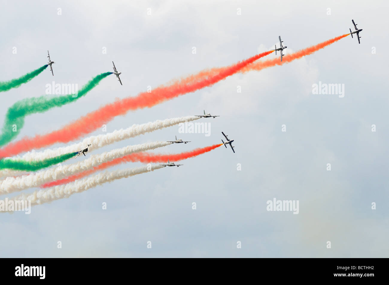 The Italian Air Force aerobatic display team Il Frecce Tricolori perform a complicated maneuver at the 2009 RIAT Stock Photo