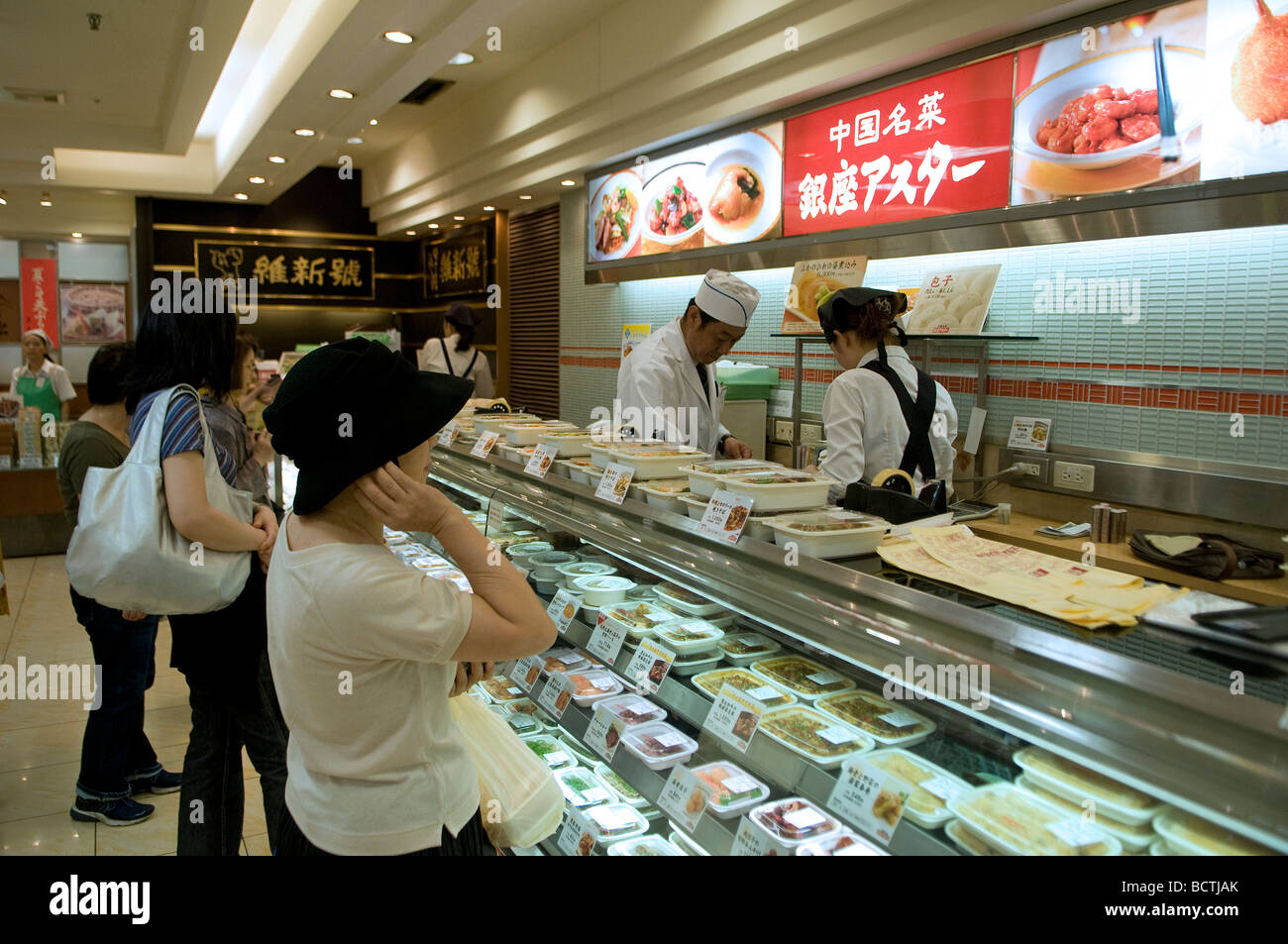 Customers buying food at a lunchbox counter in a shopping mall Tokyo
