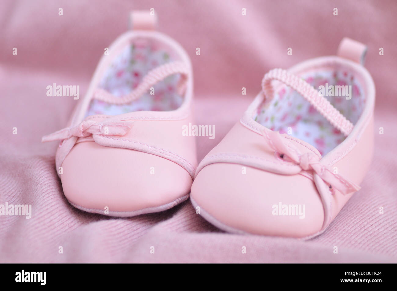Adorable pink baby girl booties Stock Photo Alamy