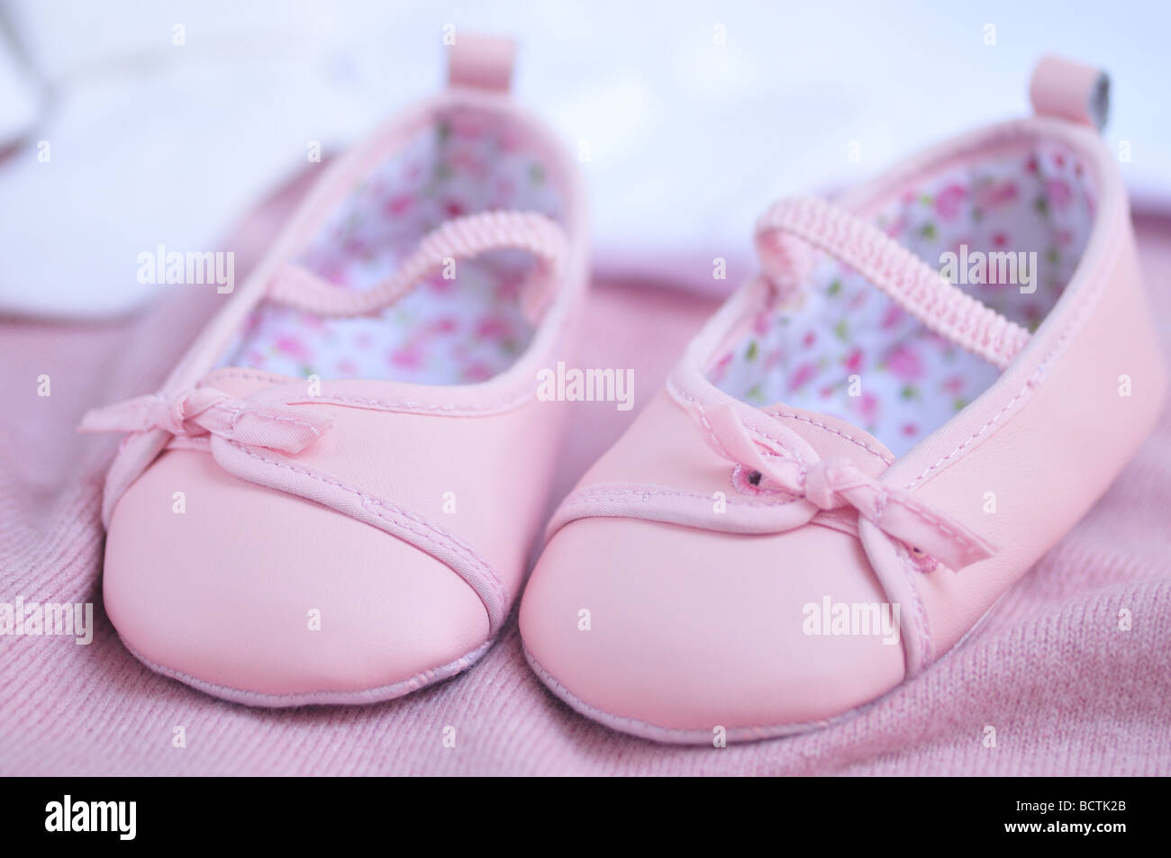 Adorable pink baby girl booties Stock Photo Alamy