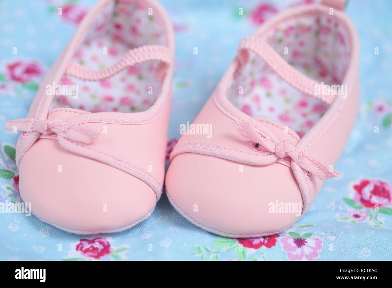 Adorable pink baby girl booties Stock Photo Alamy
