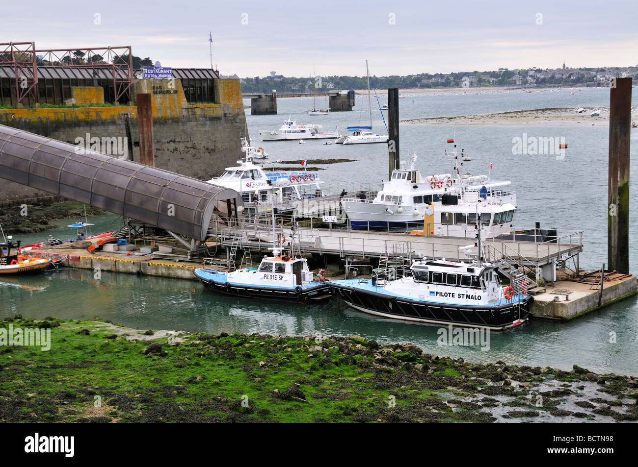 Boats in the small harbour off St Malo France Stock Photo