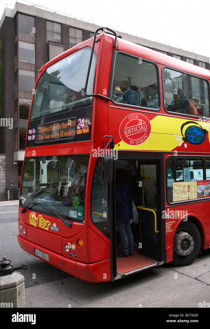 tourists on board city tour bus at stop dublin city centre republic of ireland Stock Photo