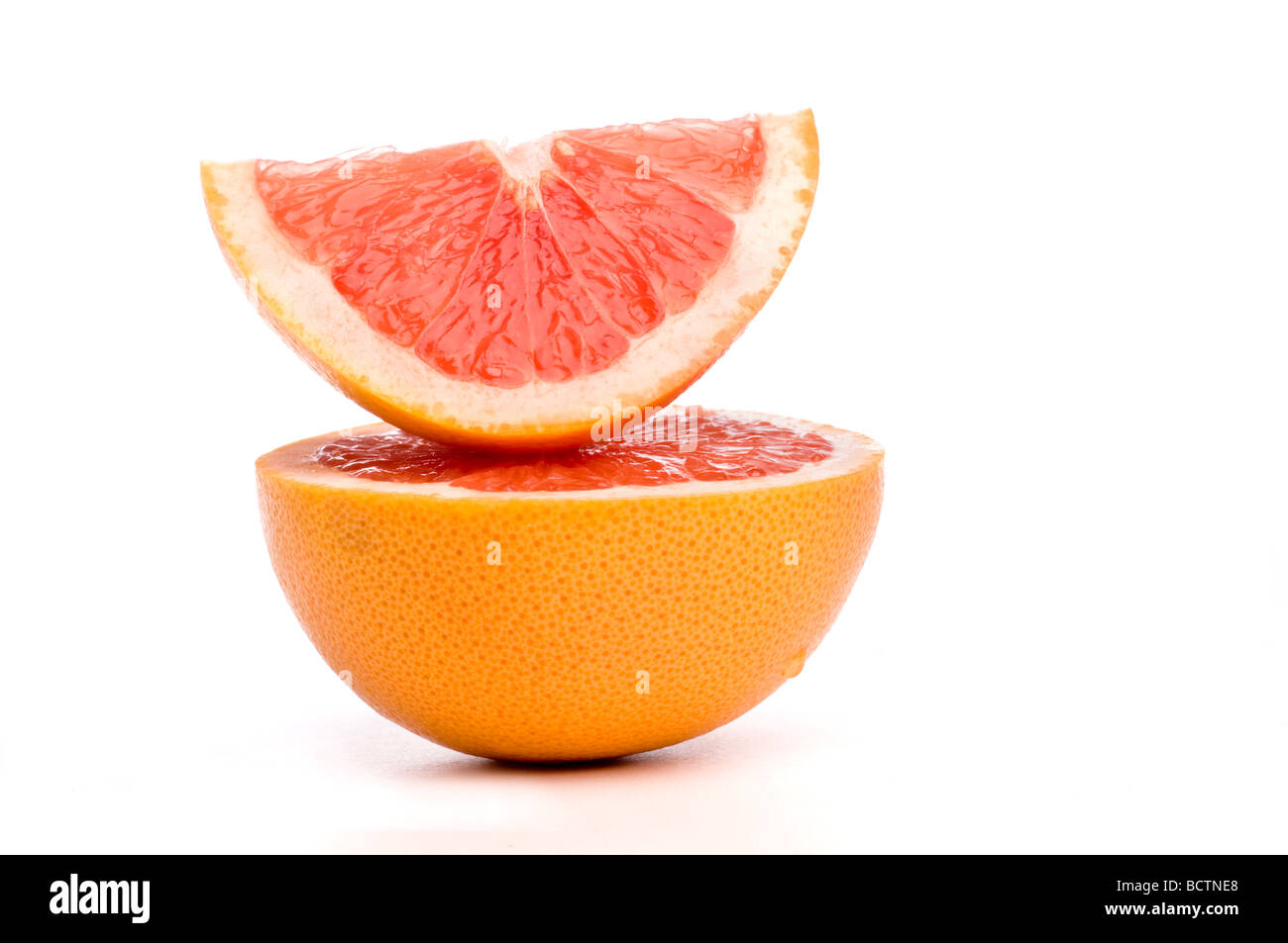 grapefruit slices arranged on top of each other. Stock Photo